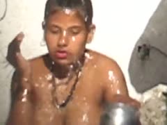 An attractive, fat, and sensual Indian slutwife taking a shower outside